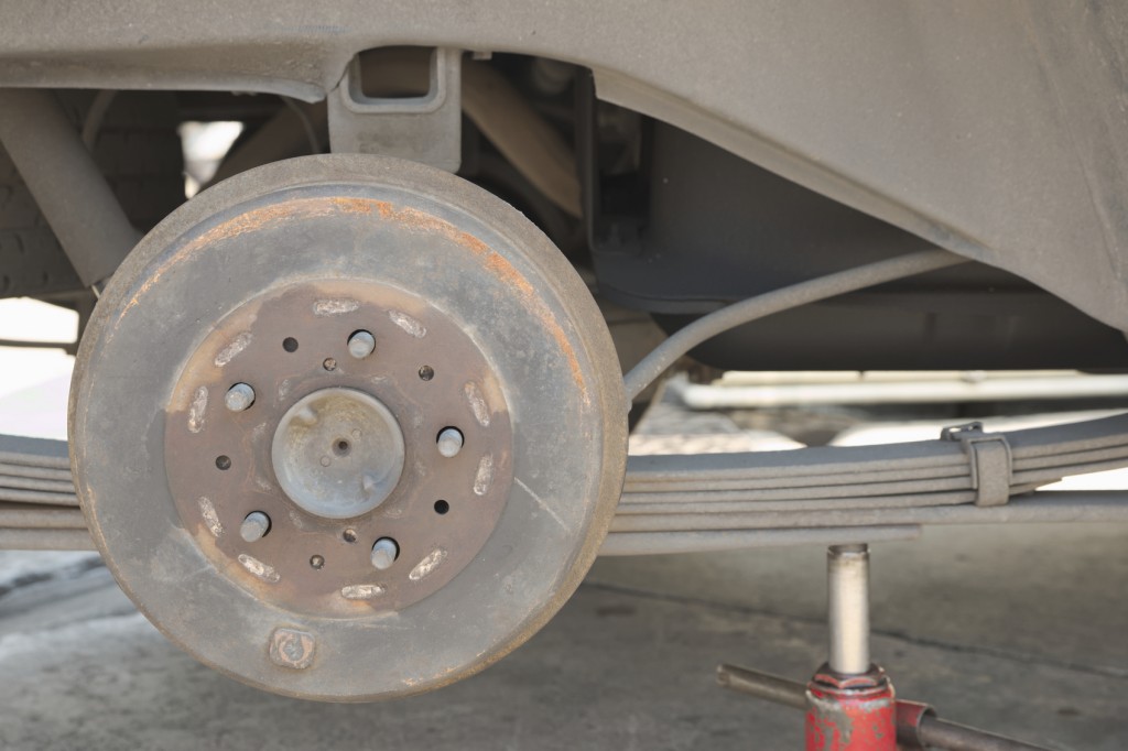 Jacked car showing its leaf spring